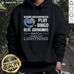 Real grandmas in Tampa Bay Lightning hoodies enjoy bingo, showcasing their love for hockey and family fun.