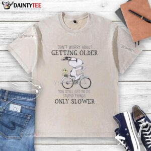 Good Snoopy graphic on a washed t-shirt with a humorous quote about aging and doing dumb stuff, perfect for casual wear.