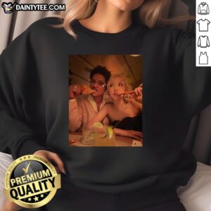 Good Bruno Mars and rose eating pizza in 2026 Grammy sweatshirt, showcasing a fun and vibrant moment.