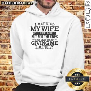 Alt Text: Humorous 'I Married My Wife For Her Looks' hoodie featuring a playful message about marital humor and looks.