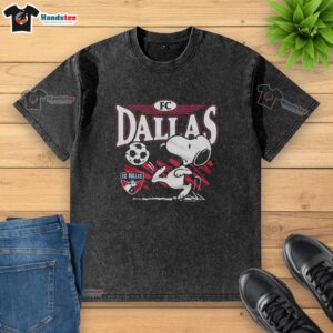 Alt Text: Top Peanuts Snoopy X FC Dallas washed t-shirt featuring a playful Snoopy graphic for soccer fans.
