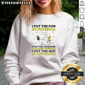 Alt Text: Snoopy sweatshirt with humorous quote: 'I Put The Fun In Funeral' showcasing unique, quirky style.