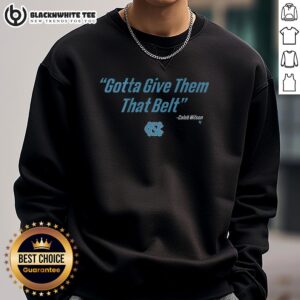 Caleb Wilson wearing a UNC basketball 'Give Them That Belt' sweatshirt, showcasing team spirit and style.