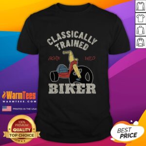 Classically trained biker wearing a 'Born Wild' T-shirt, showcasing a bold design for motorcycle enthusiasts.