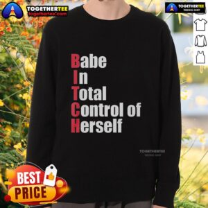Stylish woman wearing 'Top Babe In Total Control Of Herself' red sweatshirt, showcasing confidence and trendy fashion.