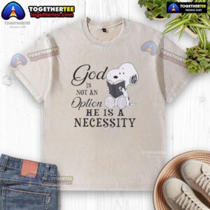 Alt Text: Trendy washed Snoopy t-shirt with 'God Is Not An Option, He Is A Necessity' slogan for casual wear.
