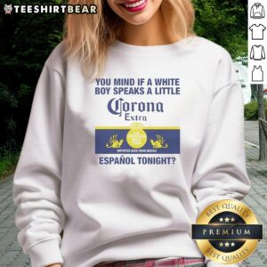White boy wearing a 'Corona Extra' sweatshirt, showcasing casual style and trendy streetwear fashion.