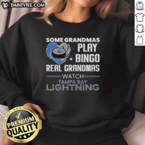 Premium sweatshirt featuring grandmas playing bingo while supporting Tampa Bay Lightning, perfect for sports fans.