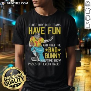 Fans wearing 'I Just Hope That Both Teams Have Fun' shirts during Bad Bunny halftime show, promoting unity and fun.