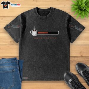 Stylish coffee bar scene featuring a 'More Coffee' washed t-shirt, perfect for coffee lovers and casual wear enthusiasts.