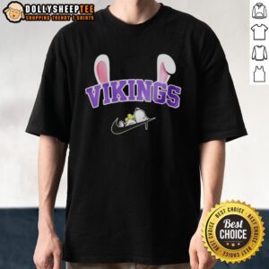 Official Minnesota Vikings X Snoopy Happy Easter T-Shirt featuring vibrant graphics of Snoopy in Vikings gear for Easter.