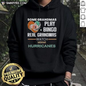Grandmas enjoying Bingo in Miami Hurricanes hoodie, showcasing fun and team spirit in a lively setting.