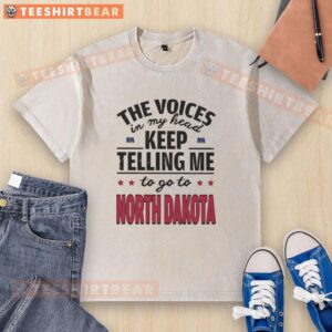 Funny washed t-shirt featuring 'The voices in my head keep telling me to go to North Dakota' graphic design.