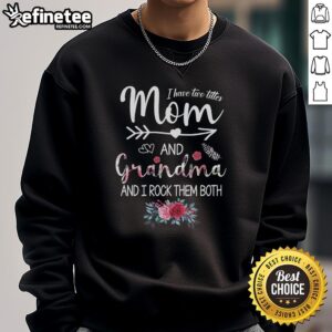 Woman wearing a 'Mom and Grandma' flower sweatshirt, showcasing pride in her dual titles.