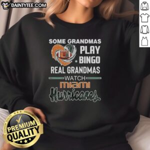 Grandmas enjoying bingo in Miami Hurricanes Heart Diamond Sweatshirt, showcasing fun and team spirit.