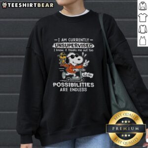 Snoopy and Woodstock riding a scooter on a fun sweatshirt with I Am Currently Unsupervised text. Perfect for fans!