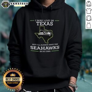 Alt Text: Funny hoodie design: 'I May Live In Texas But I'll Always Have The Seahawks In My DNA' showcasing team pride.
