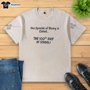 Alt Text: Bluey episode 'The 100th Day of School' features a washed t-shirt, celebrating school milestones and fun adventures.