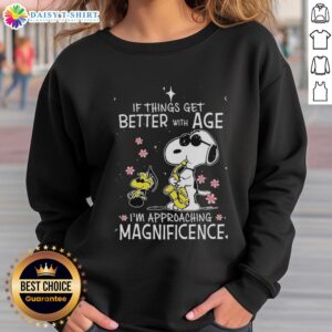 Alt Text: Cozy sweatshirt featuring Snoopy and Woodstock with the phrase If things get better with age, I'm approaching magnificence.