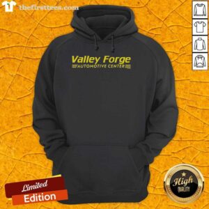 Top Tires Valley Forge Automotive Center hoodie featuring logo and stylish design for car enthusiasts and mechanics.