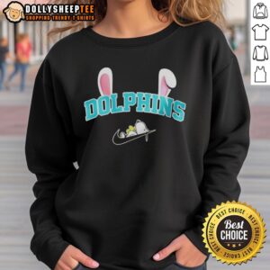 Official Miami Dolphins x Snoopy Happy Easter sweatshirt featuring vibrant colors and festive designs for fans.
