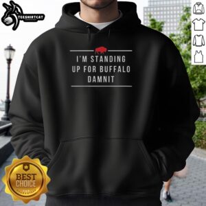 Buffalo Bills fan wearing 'I'm Standing Up For Buffalo, Damnit' hoodie, showing team spirit at a football game.