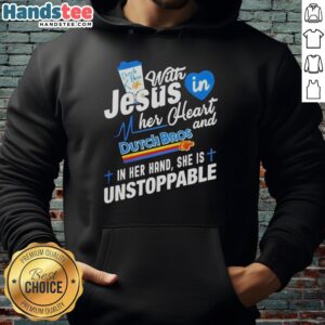 Young woman wearing 'Unstoppable' hoodie, holding Dutch Bros cup, embodying faith and positivity with vibrant background.