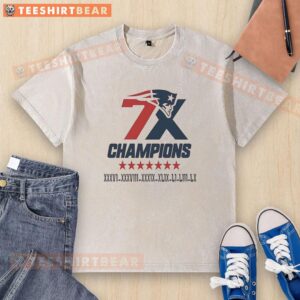 Alt Text: Official New England Patriots 7x Super Bowl Champions logo on a washed t-shirt, perfect for fans and collectors.