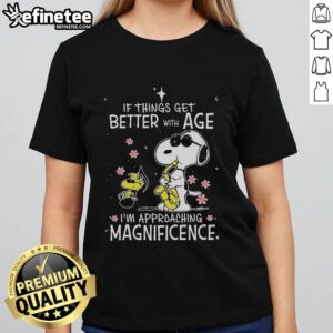 Alt Text: Original Snoopy and Woodstock tee with the phrase 'If things get better with age, I'm approaching magnificence' for ladies.