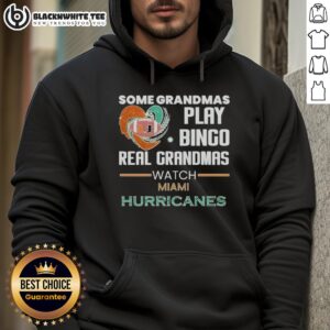 Real grandmas wearing Miami Hurricanes hoodies enjoy a game of bingo, showcasing fun and team spirit in a lively setting.