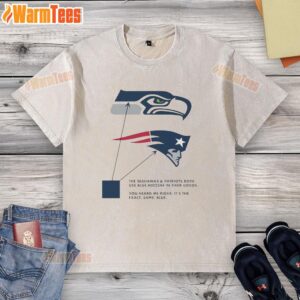Alt Text: Washed T-shirt featuring blue logos of Seattle Seahawks and New England Patriots, showcasing team pride.