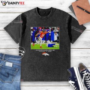 Alt Text: Top Jaquan McMillian Denver Broncos Football 2026 NFL washed t-shirt displayed on a wooden background.