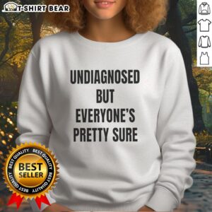 Good Undiagnosed But Everyone's Pretty Sure sweatshirt in a cozy setting, showcasing its stylish design and unique message.
