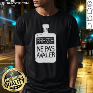 Official Thom Yorke wearing a 'Presse Ne Pas Avaler' T-shirt at a music event, showcasing his unique style and artistry.