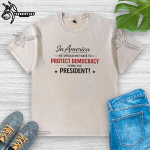Nice In America 'We Should Not Have To Protect Democracy From The President' washed t-shirt showcasing a bold political statement.