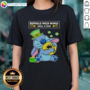 Alt Text: Cute Stitch hugging Buffalo Wild Wings Grill and Bar logo on a Happy Patrick's Day ladies tee shirt design.