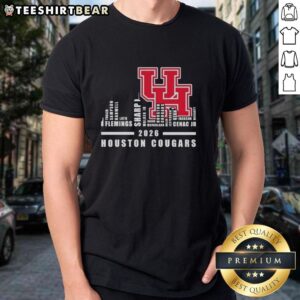 Alt Text: 2026 Houston Cougars Football T-Shirt featuring city skyline and team names, perfect for fans and supporters.