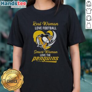 Pretty real woman in a heart tee, showcasing love for football and the Pittsburgh Penguins, celebrating smart women's sports passion.