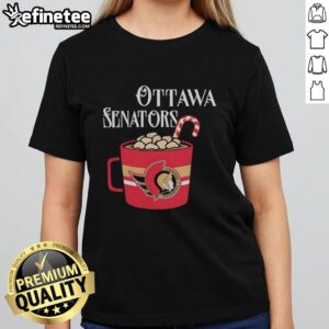 Top Ottawa Senators hockey team NFL mug next to a candy cane and a ladies tee, perfect for festive sports fans.