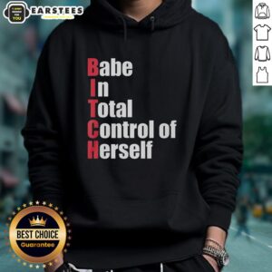 Awesome babe in total control wearing a red text hoodie, showcasing confidence and style in a trendy urban setting.