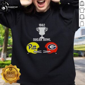Alt Text: 1982 Sugar Bowl Pitt vs Georgia helmets trophy graphic sweatshirt featuring iconic college football design.