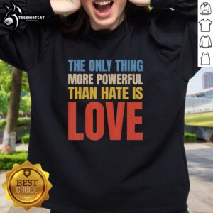 Alt Text: Vintage sweatshirt featuring the phrase Hot - The Only Thing More Powerful Than Hate Is Love in bold lettering.