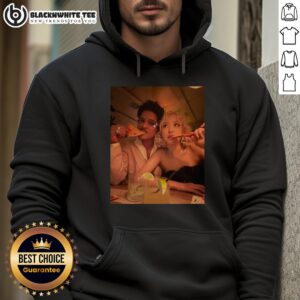 Bruno Mars enjoying pizza while wearing a stylish hoodie at the 2026 Grammy Awards, highlighting his relaxed vibe.