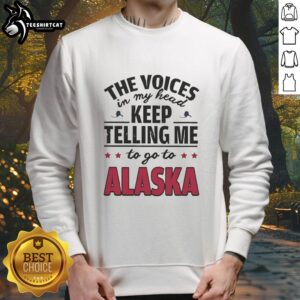 Cozy sweatshirt featuring 'The Voices In My Head Keep Telling Me To Go To Alaska' design, perfect for casual wear.