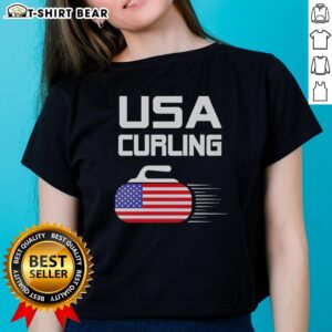 Alt Text: Official USA Curling American Flag Stone Ladies Tee featuring patriotic design for curling enthusiasts.
