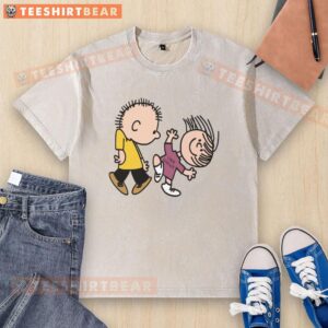 Official Peanuts Greatest Hits Rockin' Out to Linus and Lucy washed t-shirt featuring vibrant graphic design.