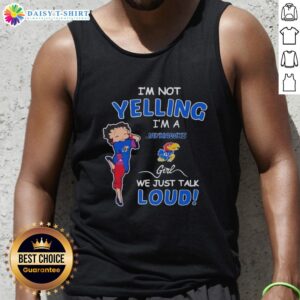 Girl wearing 'I'm Not Yelling, I'm Kansas Jayhawks' tank top, showcasing team spirit and pride in vibrant colors.