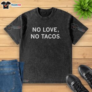 Pretty No Love No Tacos washed t-shirt displayed on a wooden surface, perfect for casual outings and taco lovers.
