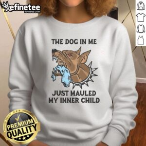 Premium 'The Dog In Me Just Mauled My Inner Child' sweatshirt in a cozy setting, perfect for dog lovers' casual wear.
