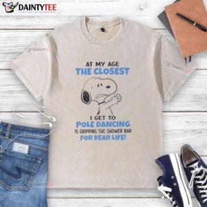 Funny Snoopy graphic on a washed t-shirt with the quote about aging and shower bars, perfect for humor and Peanuts fans.